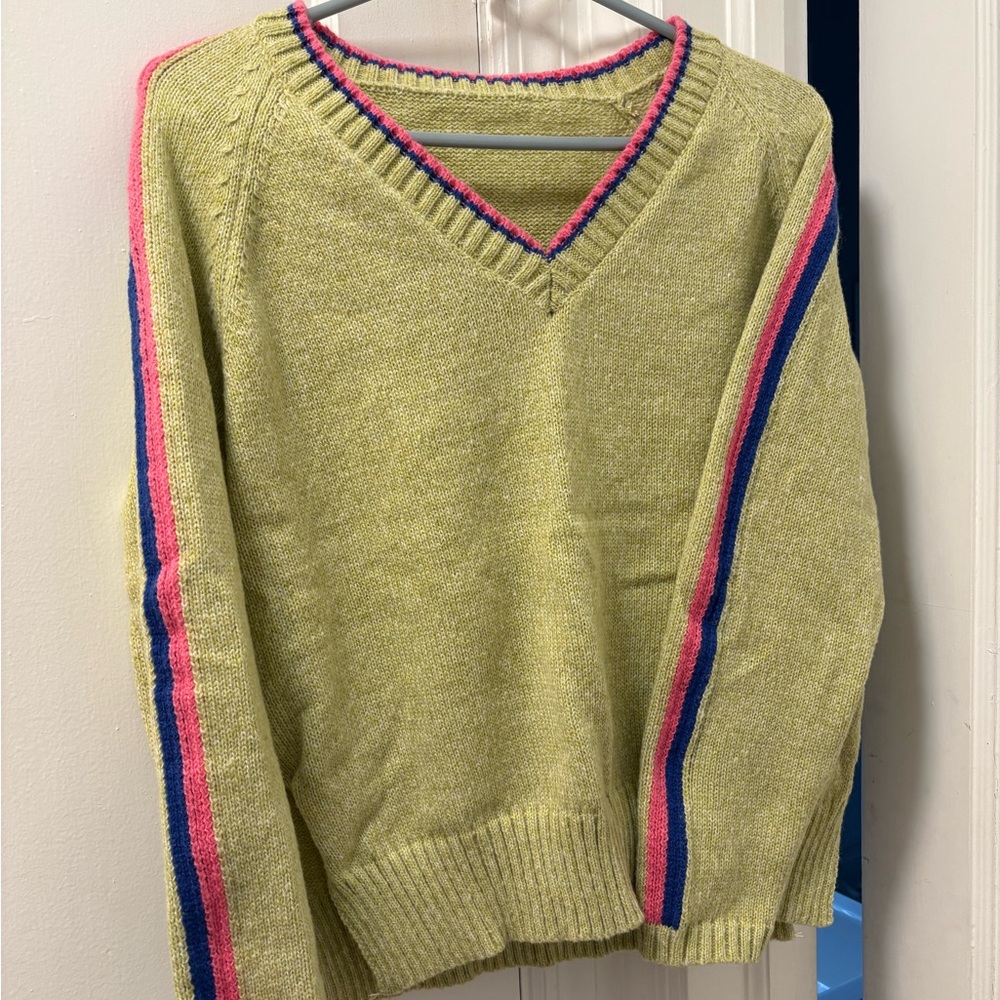 Size Medium V Neck sweater. Runs small more cropped in nature.